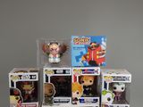 a bunch of pop vinyl figures on display in the box