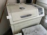 an old stove sitting next to an old washing machine