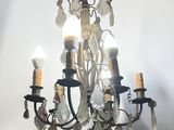 a chandelier that has a bunch of candles on it