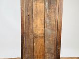 an old wooden cabinet sitting on top of a hard wood floor
