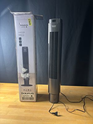 La boîte est ouverte sur la table, à côté du purificateur d'air.