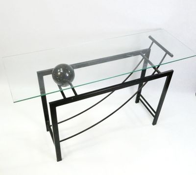 a glass table with a ball on top of it