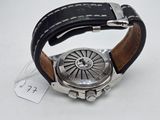 an image of a wrist watch with a leather band on a white surface