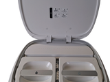 a white toilet that has two separate compartments in it