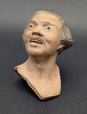 an image of a clay bust of a man