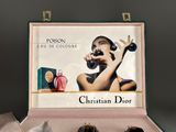 a picture of a box of perfumes with a picture of a woman in it