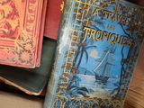 many books that are sitting on top of a table