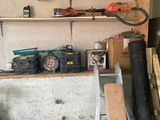 a garage with a lot of tools on the shelves
