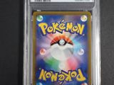 a close up of a pokemon card in a plastic case