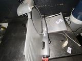 a laptop and a tennis racket sitting on a table