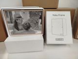 a box with a picture of a woman in a hat and a box with a picture of a woman in a hat and a box with a picture of