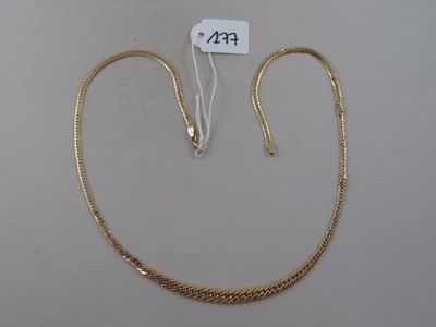 a close up of a gold chain with a price tag on it