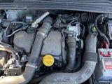 a picture of a car engine with its hood open