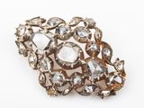 an image of a close up of a broochle on a white surface