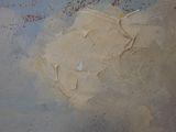 a close up of a painting of a piece of paper on a table