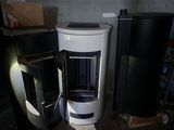 two refrigerators that are next to each other in a room
