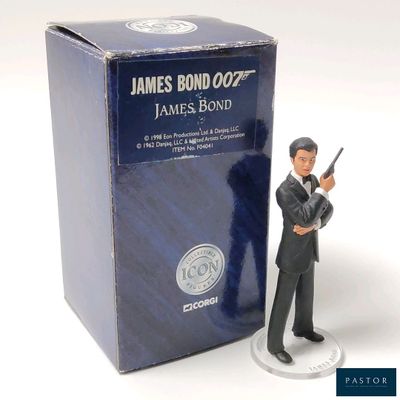 a figurine of a man holding a gun in front of a box