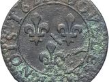 a close up of a coin with a bird on it