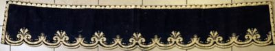 a black and white curtain hanging on a wall