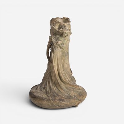 an image of a statue of a woman holding a baby