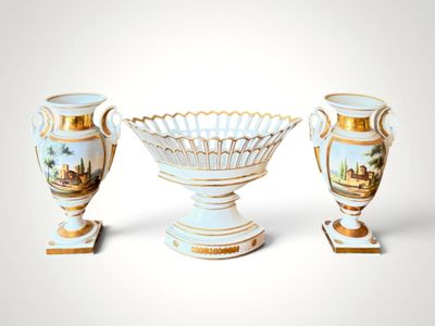 three vases sitting next to each other on a white surface