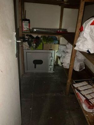 a small room with a shelf and a drawer in it