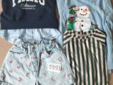 deux paires de shorts et un sweat-shirt posés sur une boîte en carton