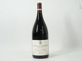 a bottle of wine that is sitting on a table