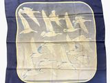 an image of a blue and yellow silk scarf with birds on it