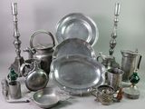 a lot of silver items that are sitting on a table