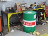 a green barrel sitting next to a green and yellow barrel