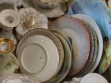 a box full of china dishes and cups and saucers