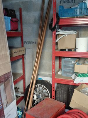a garage with a lot of boxes and tools in it