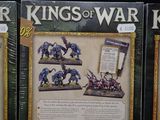 three boxed games of war on display on a black surface