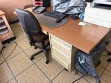 a desk with a computer and a printer on it