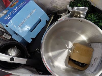 a pan with a sandwich inside of it next to other items
