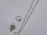 silver plated necklace, ring, and earring with a heart and flower design