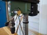 a machine that is working on a piece of wood