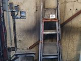 a ladder that is leaning against a wall in a garage