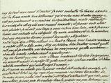 un gros plan d'un morceau de papier sur lequel on a écrit