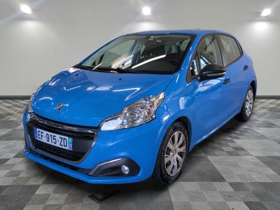 a blue car is parked in a room with a checkered floor