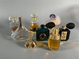 a lot of perfume bottles that are sitting on a table
