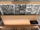 a display of glasses on a shelf in a store