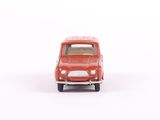 a small red toy car on a white surface