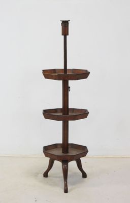 an image of a three tiered display stand with three trays on it