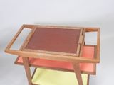 a small wooden table with a tray on top of it