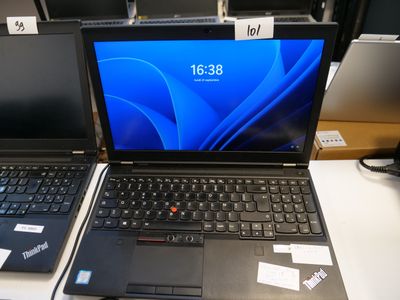 two laptops that are sitting on a table