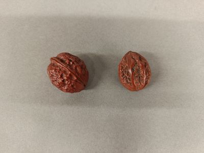 two pieces of chocolate sitting on top of a white surface