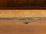 a wooden dresser with a mirror on the top of it