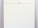 a white painting with a black frame on a white floor